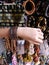Girl trying out bangles bracelets at bazaar