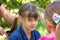 Girl trying to comb the girlâ€™s tightly tangled hair