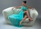 Girl in a turquoise dress on sofa