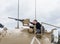 The girl is on the turret of the tank and studies the machine gun on the Memorial Site near the Armored Corps Museum in Latrun, Is