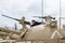 The girl is on the turret of the tank and studies the machine gun on the Memorial Site near the Armored Corps Museum in Latrun, Is