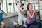 Girl And Two Guys Doing Lunge Exercises In Gym