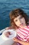 Girl with two jellyfish in boat blue sea