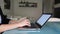 Girl typing message on the notebook computer