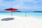 A girl and Umbrella on the beach of Maldives