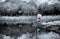 An girl with an umbrella in the snow garden