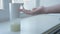 Girl using automatic foam soap dispenser, washing hands, close, macro, on the windowsill, right hand