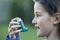 Girl Using Inhaler To Treat Asthma Attack