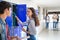 Girl using locker in college