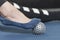 Girl using massage tool for toe massage. Close up. Exercise equipment for self-masage. Myofascial ball