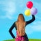 Girl with varicolored balloons