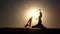 Girl with a veil in her hands dancing belly dance on the beach. Silhouette. Slow motion