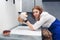 girl veterinarian holding guinea pig over table