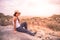 Girl at view point looking to the bush savannah of Serengeti at sunset, Tanzania - Safari in Africa