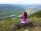 Girl at the viewpoint spreading her hands