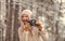 Girl with vintage camera in snowy nature. Traveling concept. Capturing winter. Take stunning winter photos. Winter hobby