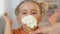 Girl waiting for tasty dessert with eyes closed, licking ice-cream with pleasure