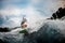 Girl wakesurfer gliding smoothly on a board