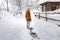 Girl walk sled alone, winter snow cold weather outdoor sledge countryside or village, blizzard a snowfall, play fun