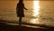 Girl walking along the beach