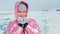 Girl walking on cracked ice of a frozen lake Baikal. Woman trave