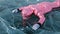 Girl walking on cracked ice of a frozen lake Baikal. Woman trave