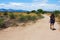 Girl walking through desert field