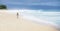 Girl walking on deserted beach