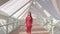 Girl walking on he Dubai water canal pedestrian footbridge