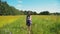 Girl walking on the field.