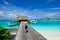 Girl walking on the footbridge in maldives