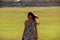 Girl walking on the grass of lighthouse in Havana Fort in Havana, Cuba