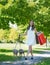 Girl walking with greyhounds