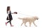 Girl walking a labrador retriever dog