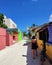 A girl walking near by colorful houses in Maldive
