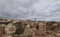 Girl walking over the Son Real Archaeological Site in the north coast of the island of mallorca wide