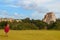 Girl walking in ruins of the ancient city in Uxmal, Yucatan, Mexico