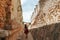 Girl walking in ruins of the ancient city in Uxmal, Yucatan, Mexico