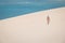 Girl walking on the white dunes on the Bazaruto Island