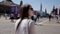 A girl walks and admires the Red Square and the Kremlin in Moscow. Excursion