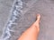 girl walks along the beach.  White sand antrd ocean.  Female tanned legs