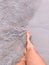 girl walks along the beach.  White sand and ocean.  Female tanned legs