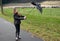 Girl walks with broken umbrella through the storm