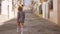 Girl Walks The Mediterranean Street Along