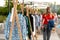 Girl walks between rows with clothes at a city fair