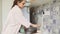 Girl washes dishes at kitchen. daily household chores.