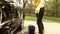 Girl washing automobile in open air. Handheld shot. Grading effect.