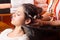 Girl washing hair in hairdressing salon