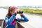 Girl watching through binoculars wild birds