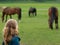 Girl watching horses